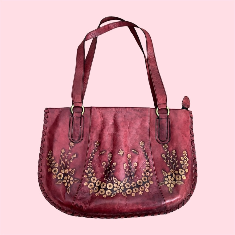 elegant vintage leather bag with floral pattern